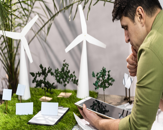 Side View Man Using tablet eco friendly wind power project layout